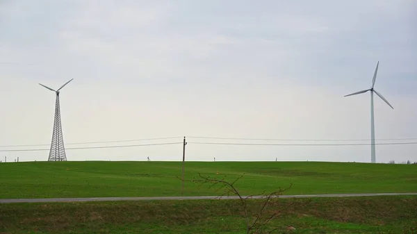 Two Wind Turbines Green Field Generate Electricity — Fotografia de Stock