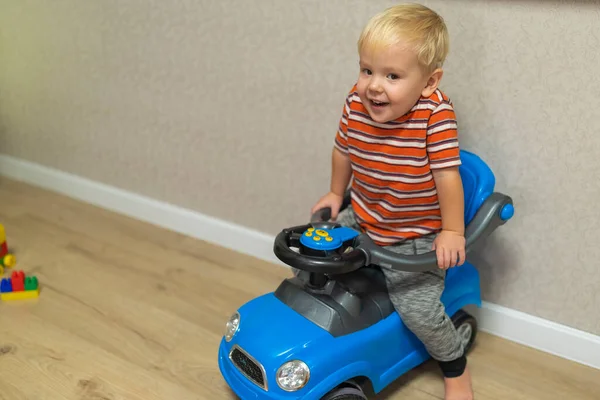 Little Blond Boy Sitting Toy Car Home — Stock Fotó