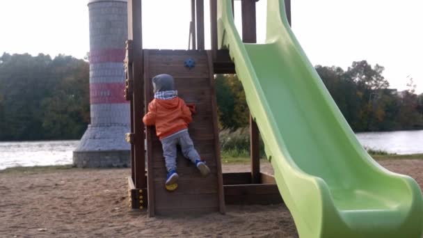 Slow Motion Boy Plays Rock Climbing Outdoor Playground — стоковое видео