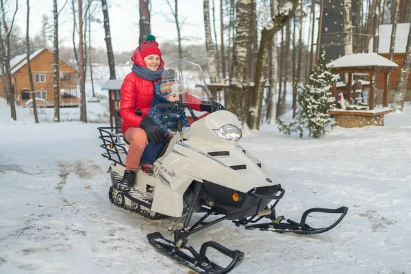 Mom Son Sit Snowmobile Snow Covered Forest Winter Fun — Stockfoto