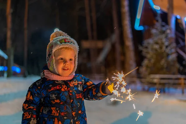 Little Boy Light Winter Sparkler Background Christmas Lights — Stock fotografie