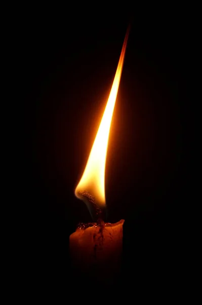 light candle burning brightly,Candle light close up on black background. Burning candle. Candle Flame.