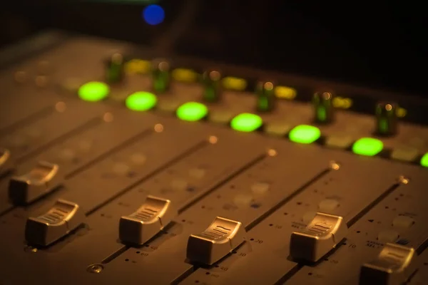 Sound recording studio mixing desk. Music mixer control panel. Closeup.
