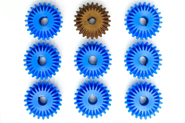 Brown Bevel Gears Stand Out Many Blue Crowds White Background — Stock Photo, Image
