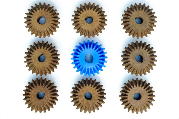Blue Bevel Gears Stand Out Many Brown Crowd White Background — Stock Photo, Image