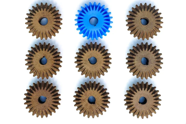 Blue Bevel Gears Stand Out Many Brown Crowd White Background — Stock Photo, Image