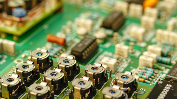 Closeup on electronic board and Electronic device, Integrated circuit chip background. Computer circuit cpu chip mainboard core processor electronics device, concept of data, hardware, technician and technology.
