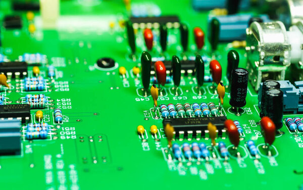 close-up of electronic circuit board with a electronic devices. Computer circuit cpu chip mainboard core processor electronics device, concept of data, hardware, technician and technology.