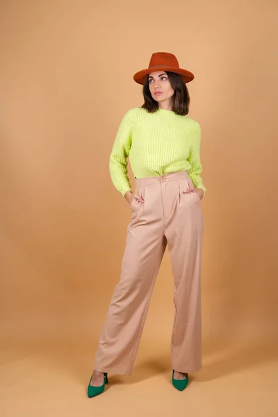 Fashionable Stylish Woman Full Growth Beige Background Trousers Sweater Hat — Stock Photo, Image