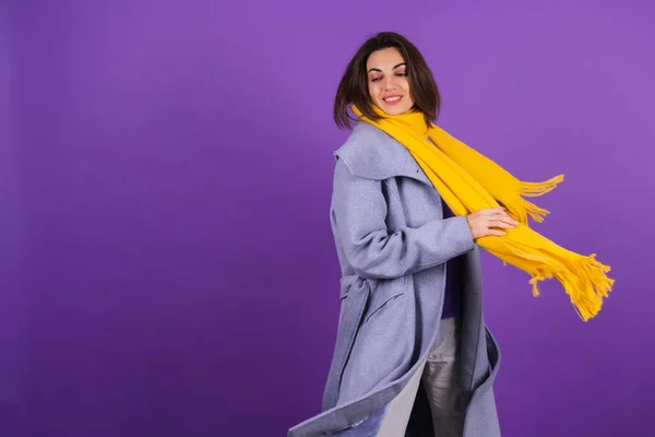 Young Woman Gray Coat Yellow Scarf Purple Background Posing Cheerfully —  Fotos de Stock