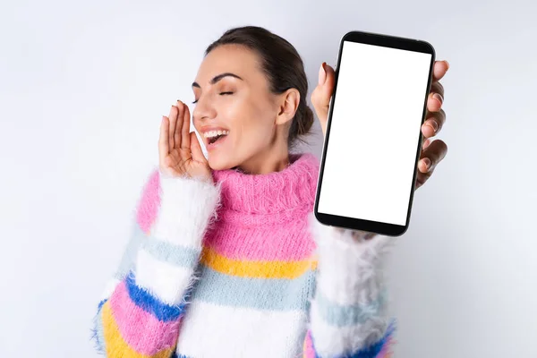 Young Cheerful Girl Bright Colored Sweater White Background Holds Big — Stock Photo, Image