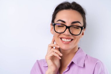 Young woman in a lilac shirt on a white background in glasses for vision cheerful positive in a good mood clipart