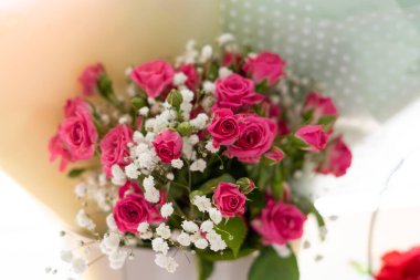 Bouquet of pink roses and gypsophila top view