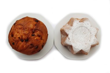 Traditional italian Christmas cakes called Pandoro and Panettone on  plates with festive decorations on white background clipart
