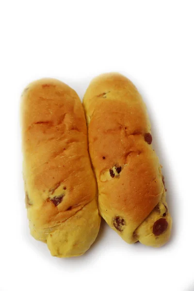 Zoete Zelfgemaakte Lange Broodjes Met Rozijnen Geïsoleerd Witte Achtergrond — Stockfoto