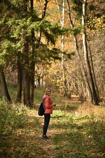 a woman enjoys nature in a beautiful forest