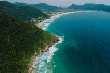 Tropical coastline with mountains and Atlantic ocean with waves in Brasil. Aerial view