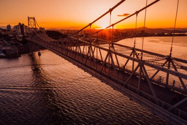 Cable stayed bridge with sunset sky in Florianopolis, Brazil. Aerial drone view