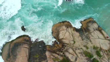Rocks coastline and ocean with waves. Aerial view of sea landscape