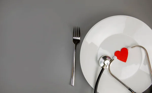 White Plate Red Heart Stethoscope Knife Fork Grey Background Copy — Foto Stock
