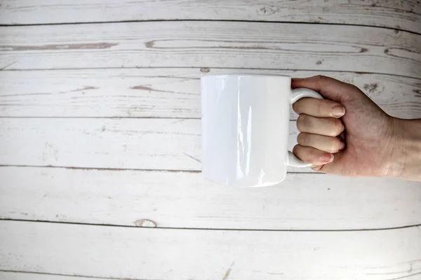 Hand Holding Ceramic Mug Blank Wooden Background Copy Space Space — Fotografia de Stock