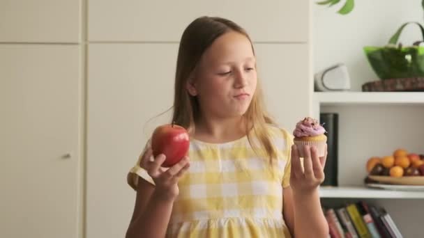 Difficult Choice Fruit Sweetness Girl Chooses Cupcake Apple — Stock Video