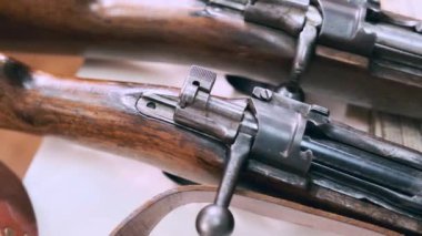 close-up slow-motion panorama of vintage rifles