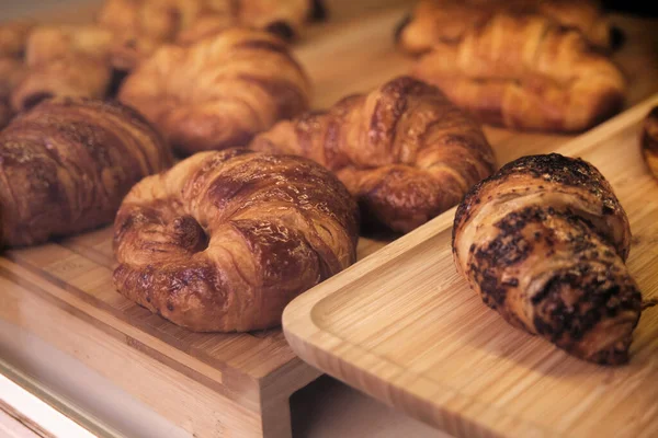 close-up of mouth-watering croissants on the wind of a bakery or coffee shop