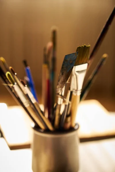 Beautiful Lighting Table Glass Different Paint Brushes — Stockfoto