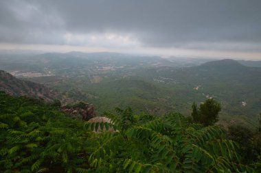 beautiful summer mountain landscape in cloudy sky
