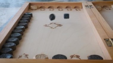 backgammon game throwing dice close-up movement of chips