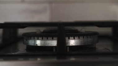 a fire is lit on the gas stove