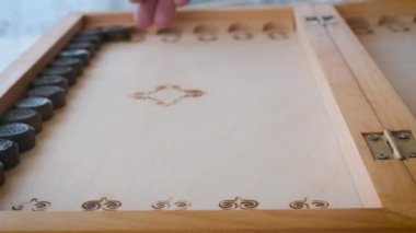 backgammon game throwing dice close-up movement of chips