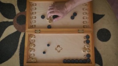 backgammon video boards on top during the game of a boy and a man