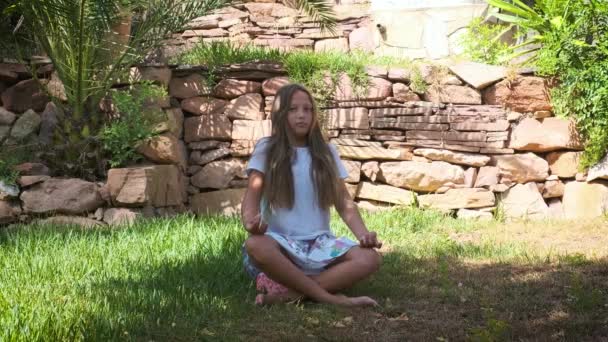 Girl Long Hair Garden Sitting Grass Meditative Pose — стоковое видео