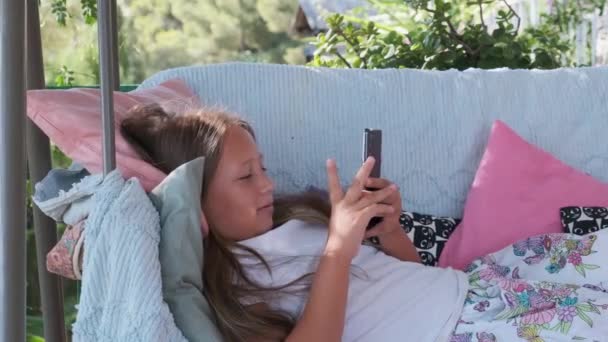 Girl Sitting Terrace Playing Games Gadget — Vídeos de Stock