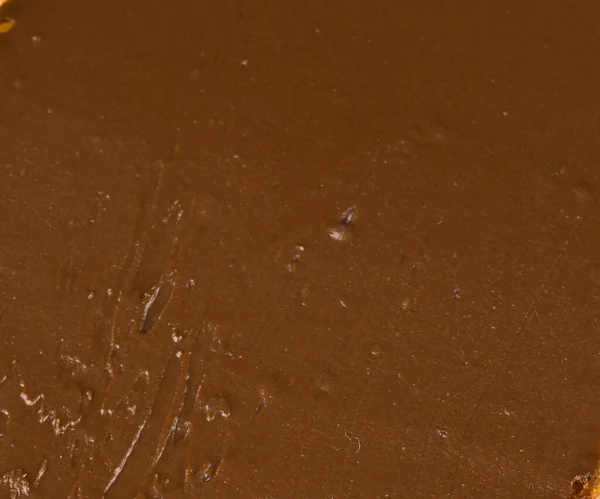 A textura da pasta de chocolate closeup. Café da manhã — Fotografia de Stock