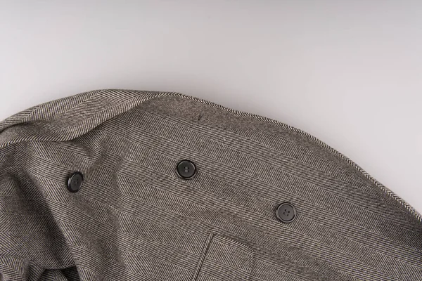 MOSCOW, RUSSIA-23 Şubat 2022: Herringbone desenli markalı klasik bir ceketin parçası. Düğmeler ve bir cep görülebilir — Stok fotoğraf