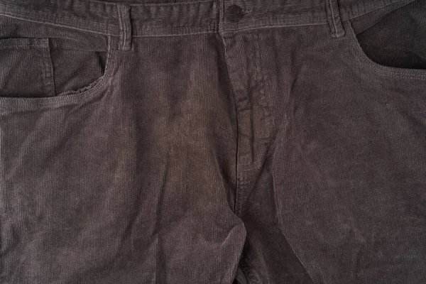 De voorkant van een donkere corduroy broek. Sluiten — Stockfoto
