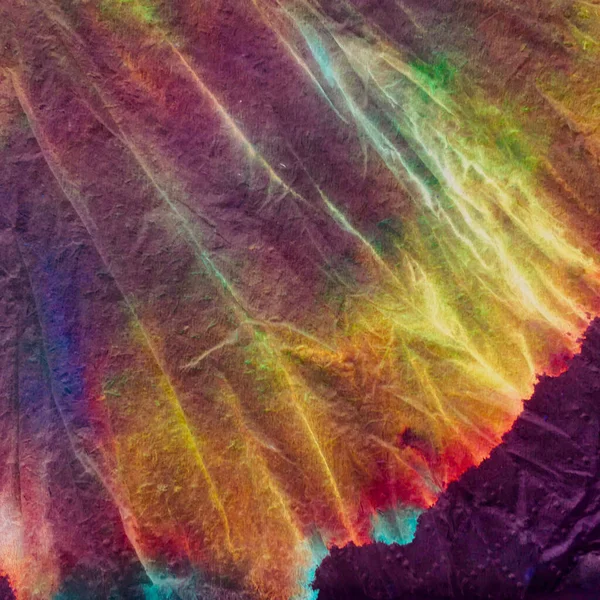 Geleneksel kravat boyası deseni. Gökkuşağı Suluboya Kumaşı. Leke Yamalı Tekstil. Arkaplan Geleneksel Kravat Şablonu. Basit bir organik kaleydoskop elementi. Kırmızı Bağlı. 