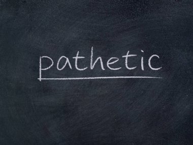 Tahta arka planda acınası bir kavram kelimesi