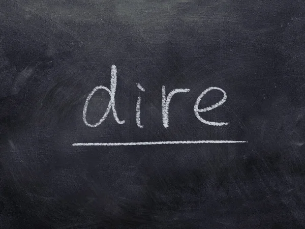 Dire Concept Word Blackboard Background — Stock Photo, Image