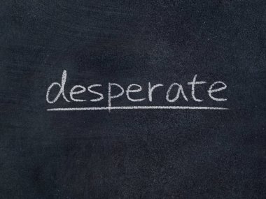 Tahta arka planda umutsuz konsept kelime