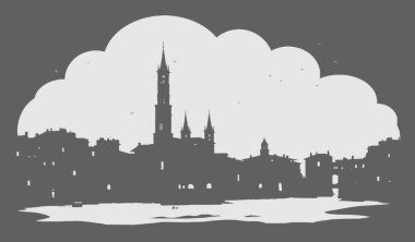 Bulutlu bir arka planda küçük antik bir şehrin gece görüntüsü.