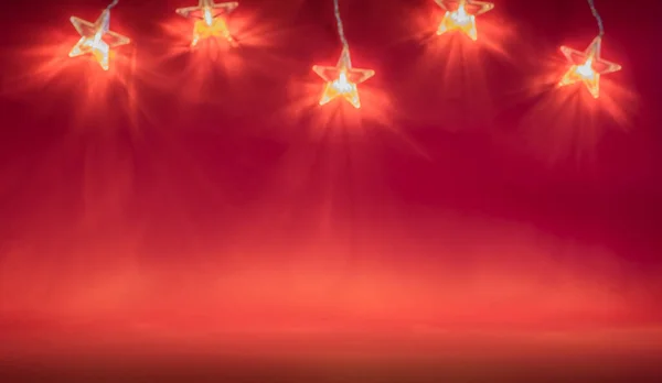 Fényes Narancssárga Csillagok Sorozata Vörös Háttér Karácsonyi Dekoráció — Stock Fotó