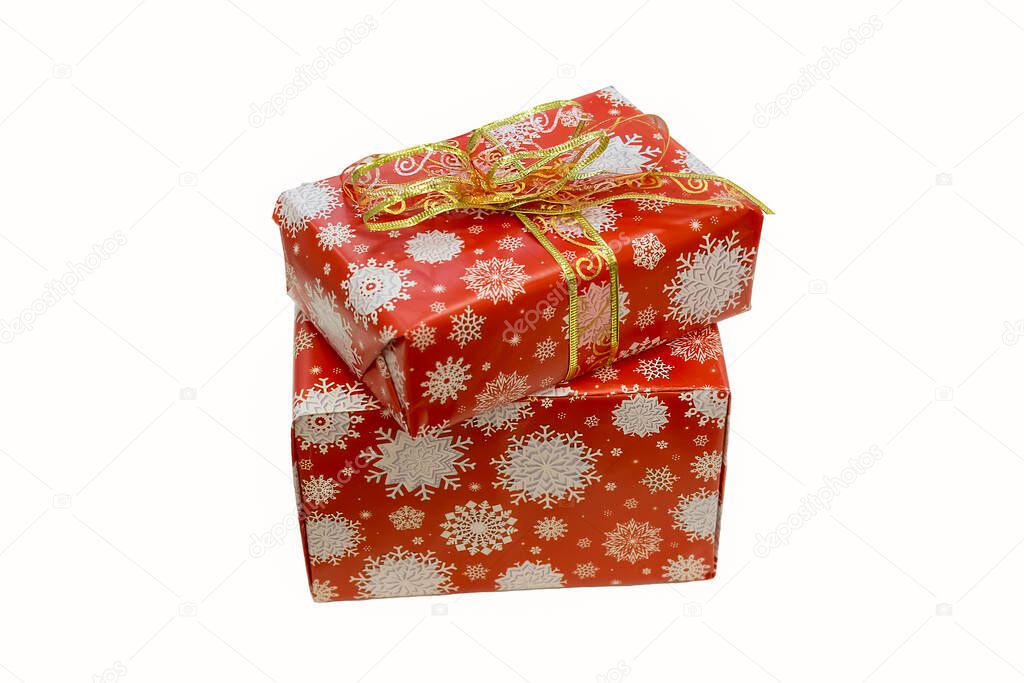 red holiday boxes tied with a ribbon on a white background