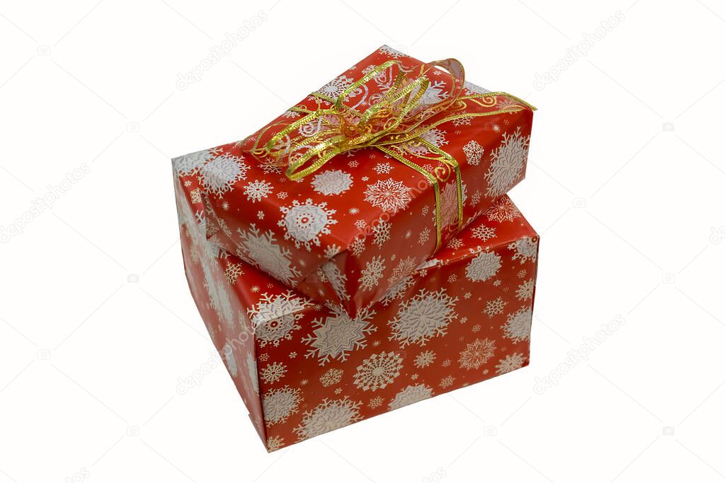 red holiday boxes tied with a ribbon on a white background