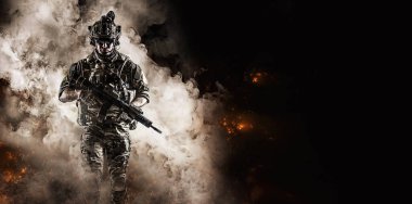 soldier fighter comes out of the smoke on the battlefield. united states military special operations. Computer games.