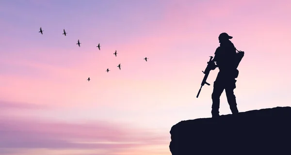 war and peace soldier silhouette on sunset sky background military concept