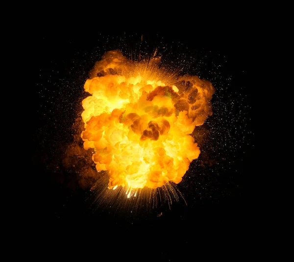 Fiery bomb explosion with sparks isolated on black background
